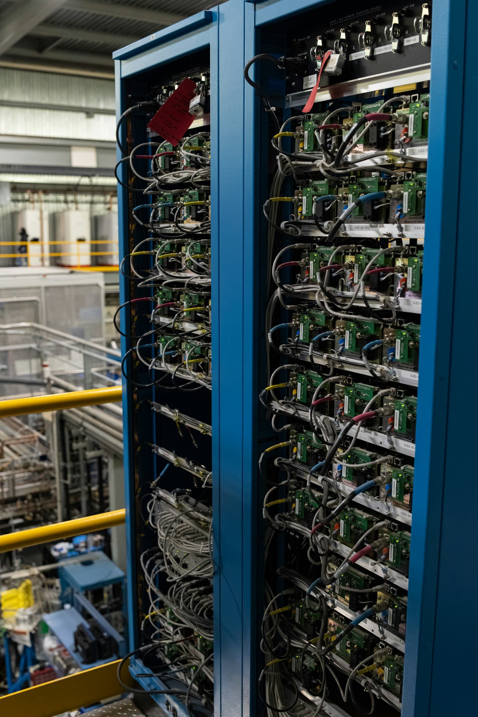 Open server rack filled with dense electronic components and wiring