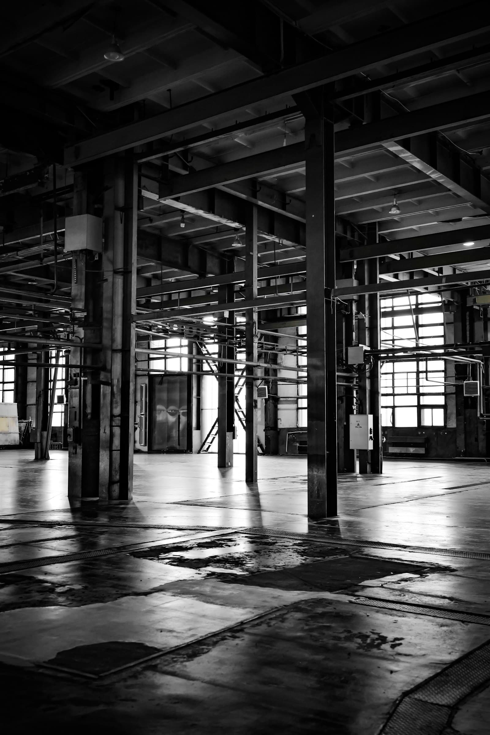Empty industrial manufacturing floor with large windows